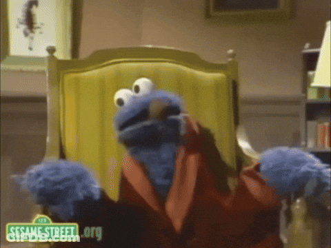 Cookie Monster Is Sitting In A Chair With A Sesame Street .Org Logo GIF