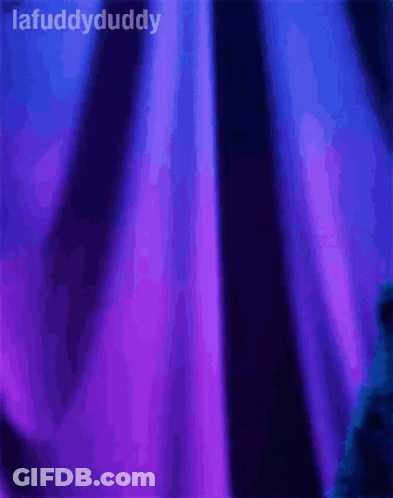 Cookie Monster Is Standing In Front Of A Purple Curtain With The Words Lafuddydaddy Above Him GIF