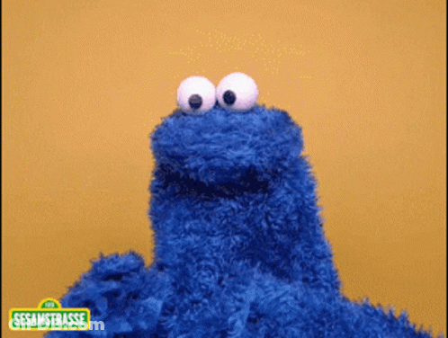 Cookie Monster On Yellow Background GIF