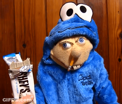 Cookie Monster Puppet Holding Hershey's Chocolate Bar GIF