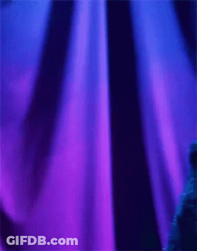 Cookie Monster Standing In Front Of Blue Curtain GIF