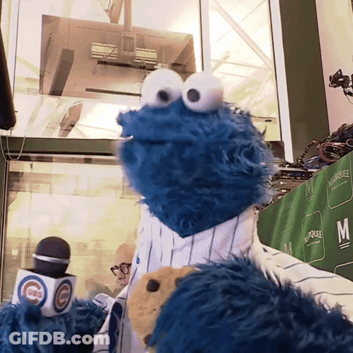 Cookie Monster Standing In Front Of Microphone Saying Cubs GIF