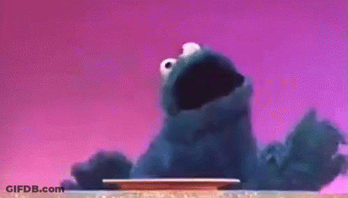 Cookie Monster Standing Next To Plate With Mouth Open GIF
