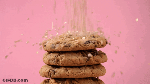 Cookie With Bite Taken Out On Pink Background GIF