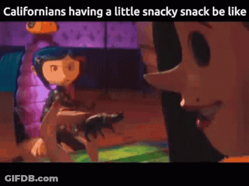 Coraline From Coraline The Animated Movie Is Holding A Cat In Her Hand GIF