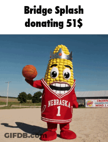Corn Mascot Holding Basketball In Nebraska Jersey GIF