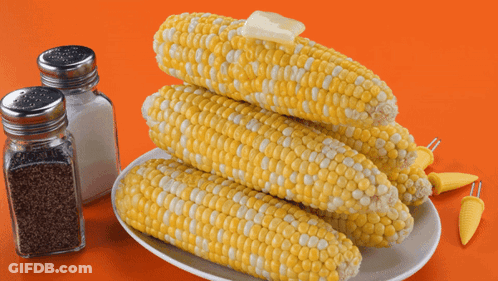 Corn On The Cob With Butter On Top Of It GIF