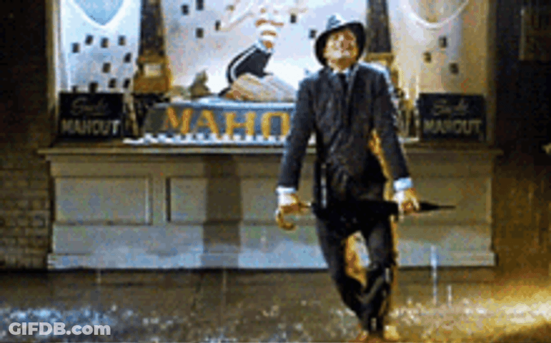 Cosmo Brown With His Umbrella Dancing In The Rain GIF