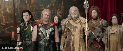 Costumed Group Standing Together GIF