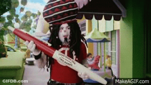 Costumed Person Holding Red White Pen With Letter A GIF