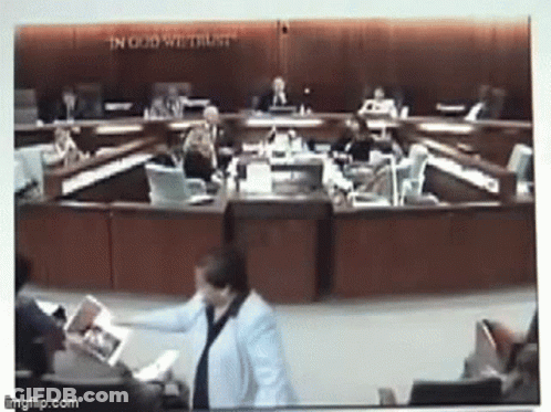 Council Meeting With In God We Trust Behind Them GIF