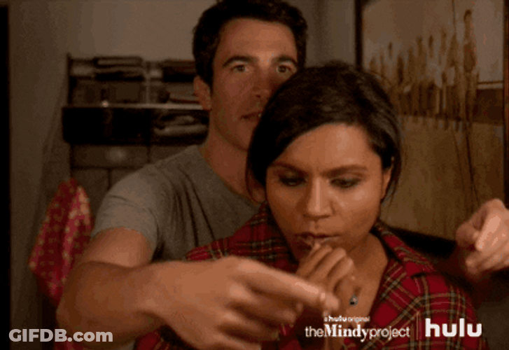 Couple Aiding On Necklace Mindy Project GIF