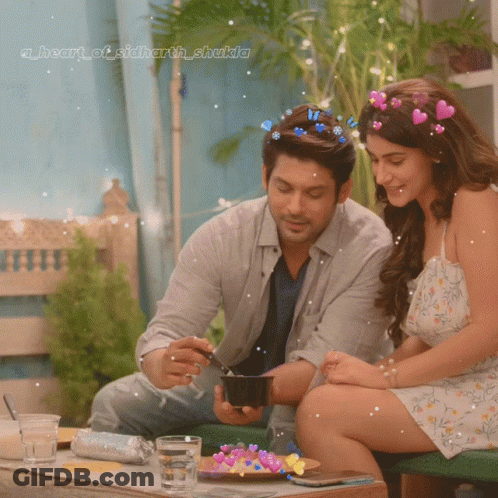 Couple At Table With Heart Of Sidharth Shakila GIF