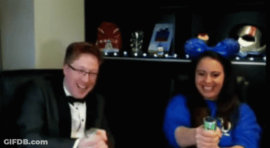 Couple Blow The Confetti Cannon GIF