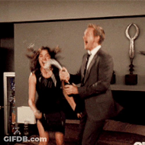 Couple Celebrating Champagne Popping GIF