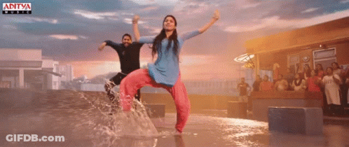 Couple Dancing In Puddle With Aditya Music Logo GIF