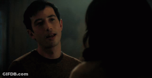 Couple Eye To Eye With Red Curtain GIF