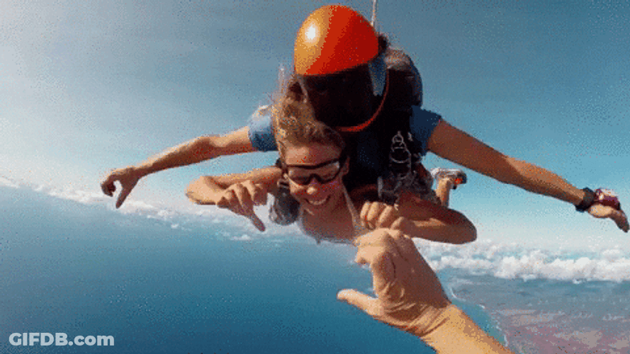 Couple Hand Heart Gesture Sky Diving GIF