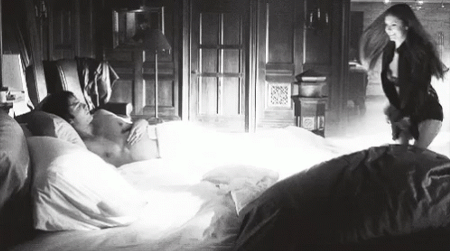Couple In Bed Happy Girl Jump Off Bed GIF