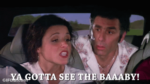 Couple In Car Saying Ya Gotta See The Baaaby GIF