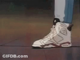 Couple In Sneakers Standing On Sidewalk GIF