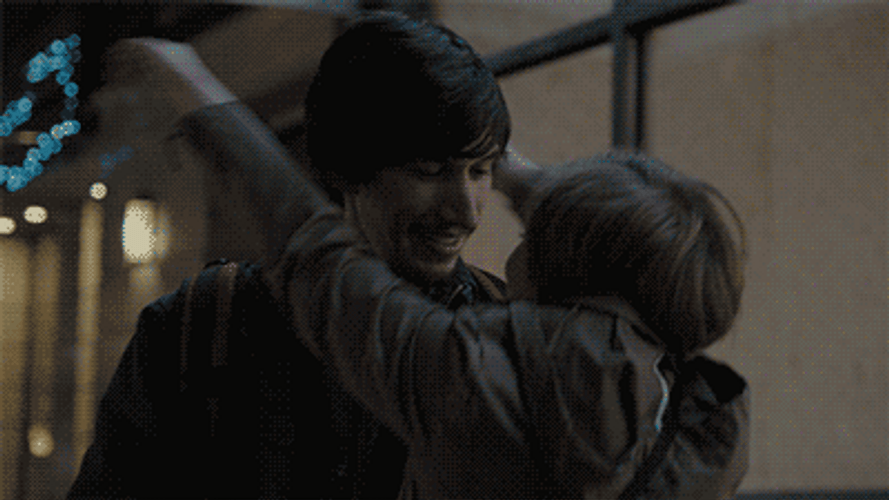 Couple Intimately Hugs And Kisses GIF