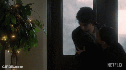 Couple Kissing In Front Of Window With Netflix GIF