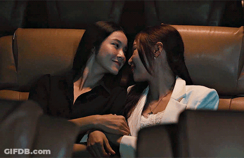 Couple Kissing On A Couch GIF