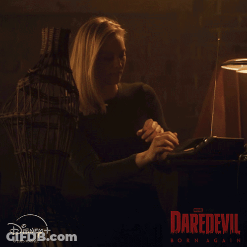 Couple Looking At Each Other In Dark Room GIF