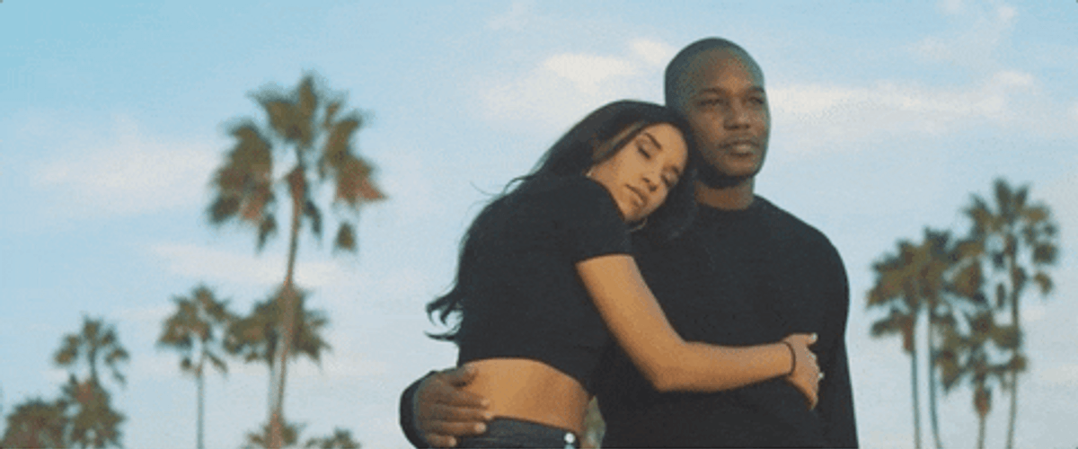 Couple Looking In Sunset GIF