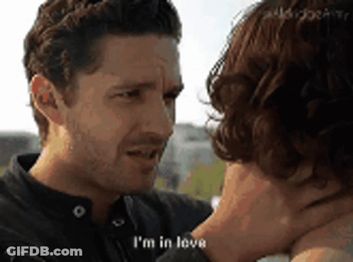 Couple Looking, Man Saying I'm In Love GIF