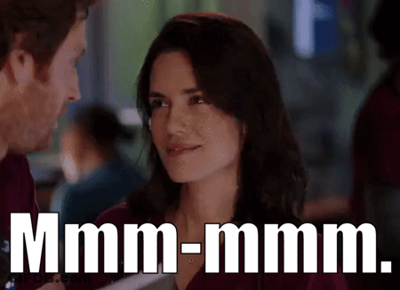 Couple Looking, Smiling Woman, Man Says Mmmm-Mmm GIF