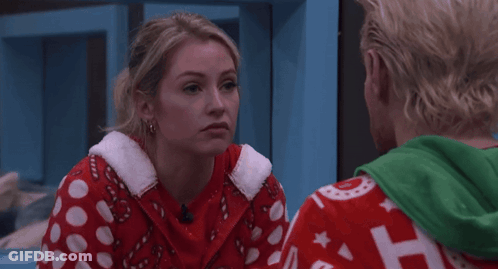 Couple Looking Woman In Red Candy Cane Sweater GIF