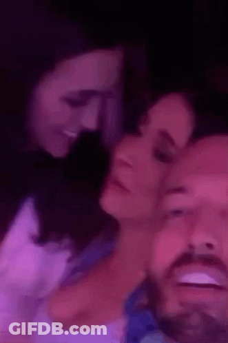 Couple Lying On Each Other In Purple Room GIF