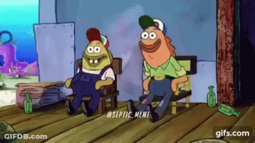 Couple Of Cartoon Characters Sitting On Wooden Floor GIF