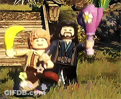 Couple Of Lego Figures Standing In Field GIF