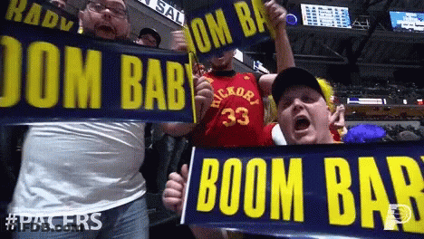 Couple Of Men Holding Signs Saying Boom Bab GIF