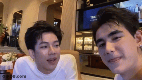 Couple Of Men Sitting In Front Of Television GIF