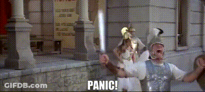 Couple Of People In Front Of Building With Panic GIF