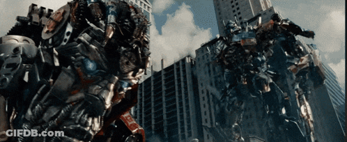 Couple Of Robots In Front Of City Skyline GIF