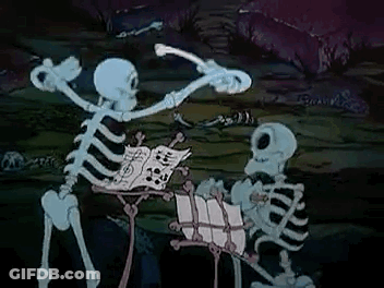 Couple Of Skeletons Standing In Dark Room GIF