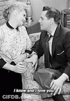 Couple On Couch Saying I Know And I Love You GIF