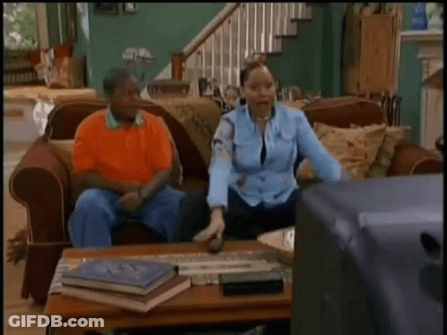 Couple On Couch With Woman Dancing GIF