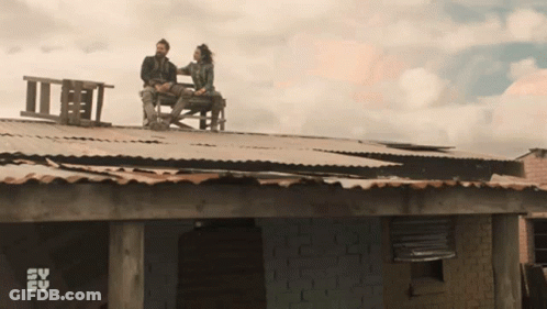Couple On Roof With SV FV Logo Behind GIF