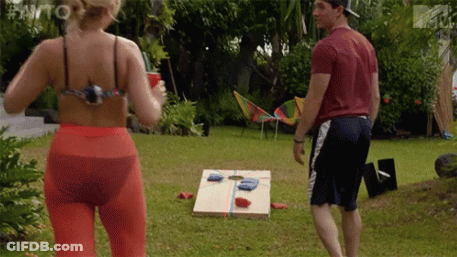 Couple Playing Cornhole GIF
