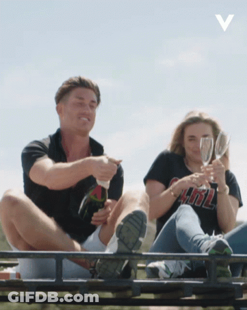 Couple Popping Champagne GIF
