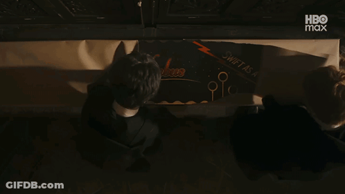 Couple Reading Swift As A Bee Sign GIF
