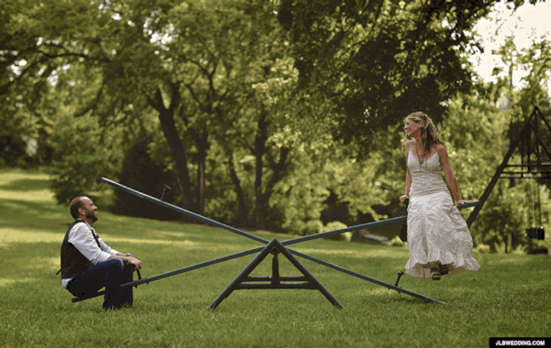 Couple Riding Seesaw Funny Wedding GIF