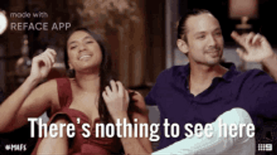 Couple Sitting Hand Signs Nothing To See Here GIF