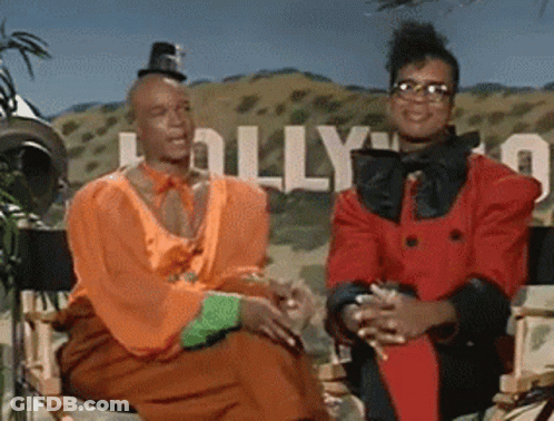 Couple Sitting In Front Of Hollywood Sign GIF